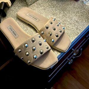 White Steve Madden sandals with silver spikes